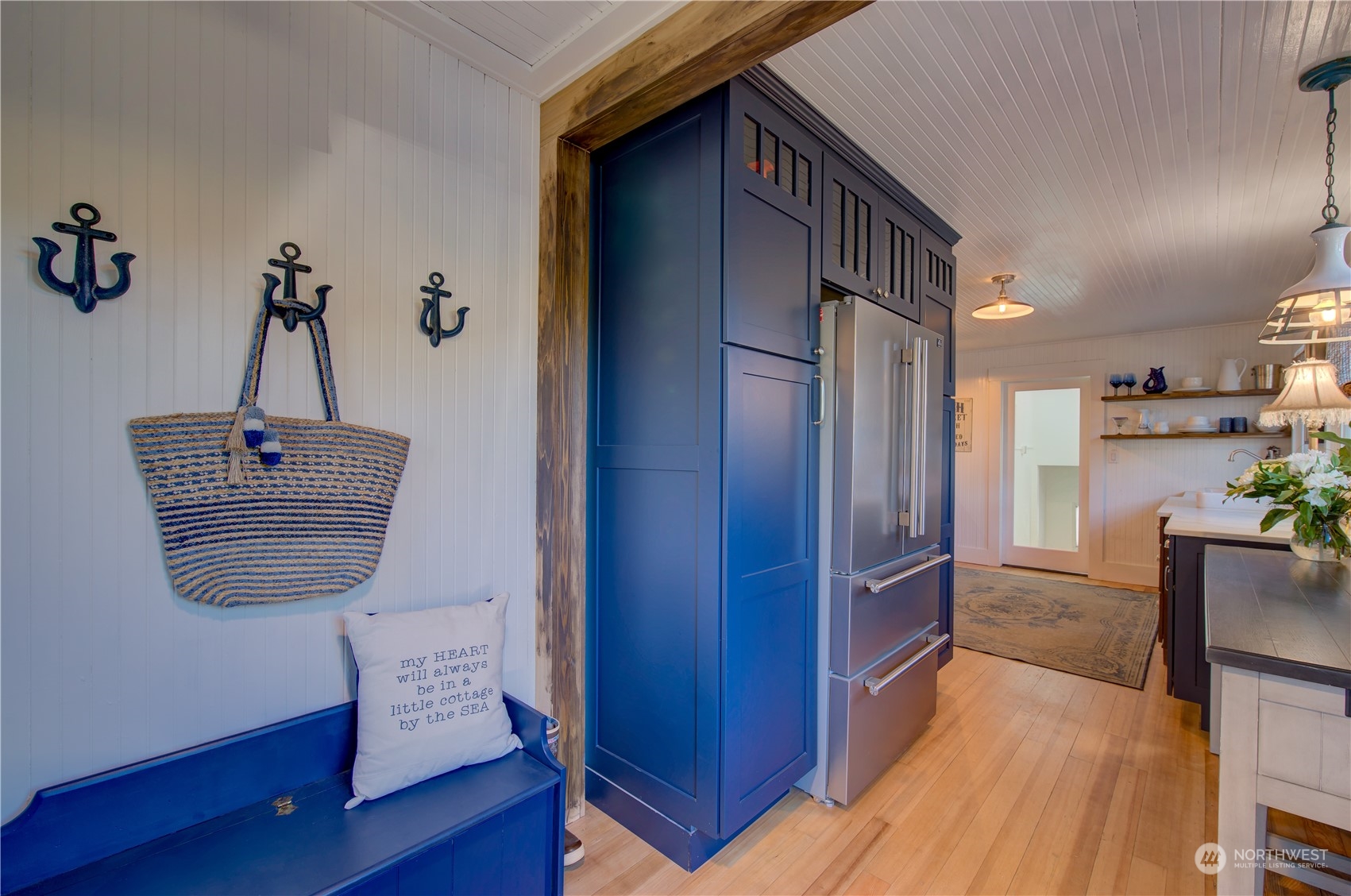 4202 L Place Seaview, WA 98644 - Photo 12 of 39 a view of hallway with furniture and wooden floor