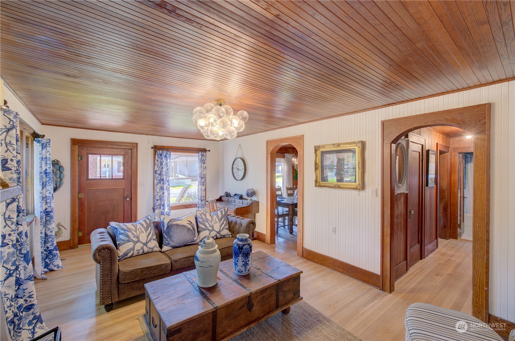 4202 L Place Seaview, WA 98644 - Photo 6 of 39 a living room with furniture and a chandelier