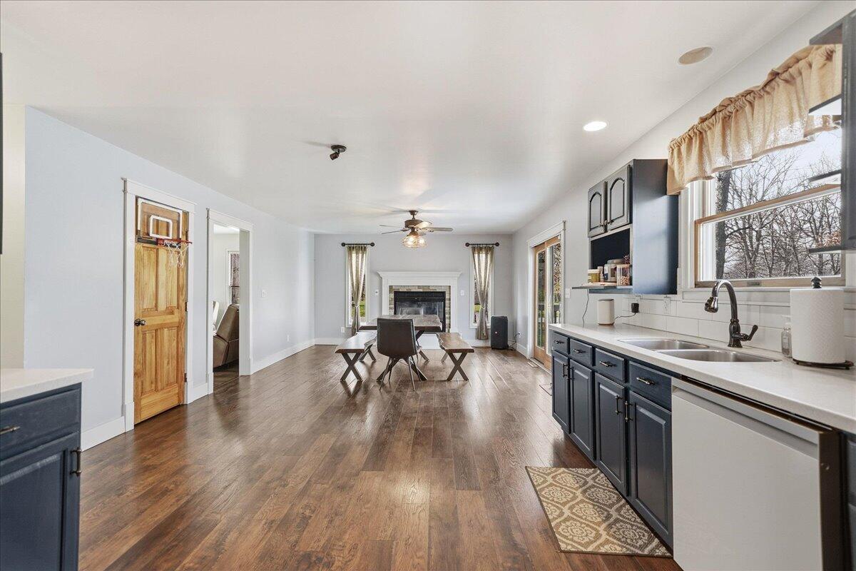 9642 West 1100th Street North Demotte, IN 46310 - Photo 13 of 37 a living room with furniture a fireplace and wooden floor