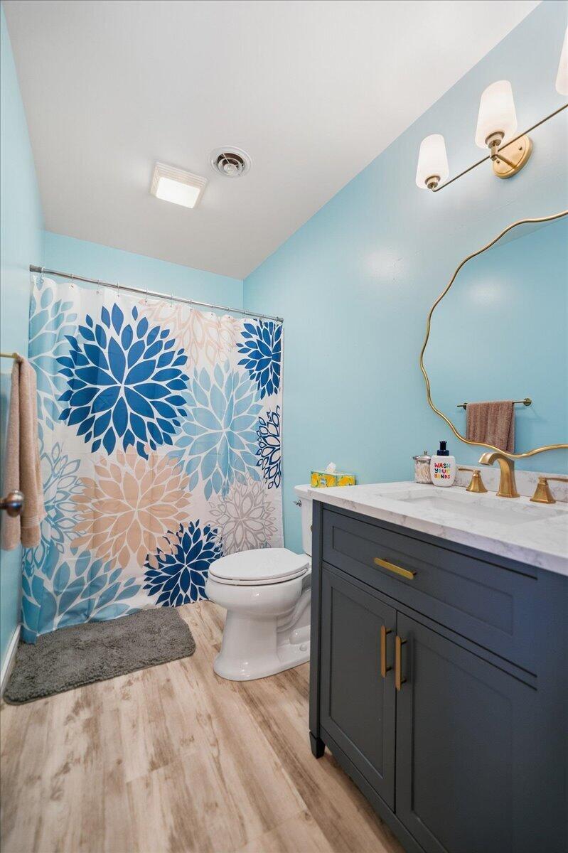 9642 West 1100th Street North Demotte, IN 46310 - Photo 18 of 37 a bathroom with a sink mirror vanity and toilet
