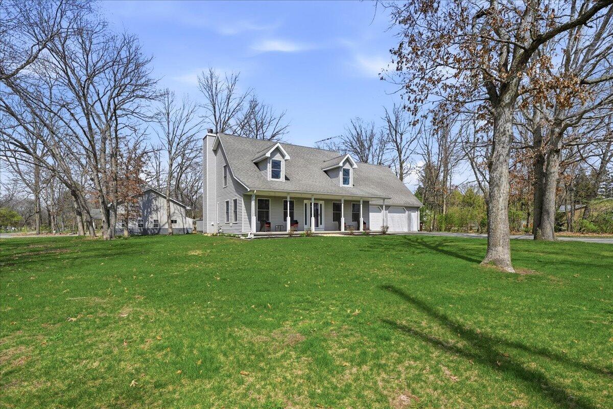 9642 West 1100th Street North Demotte, IN 46310 - Photo 2 of 37 a view of a big yard with large trees and a big yard