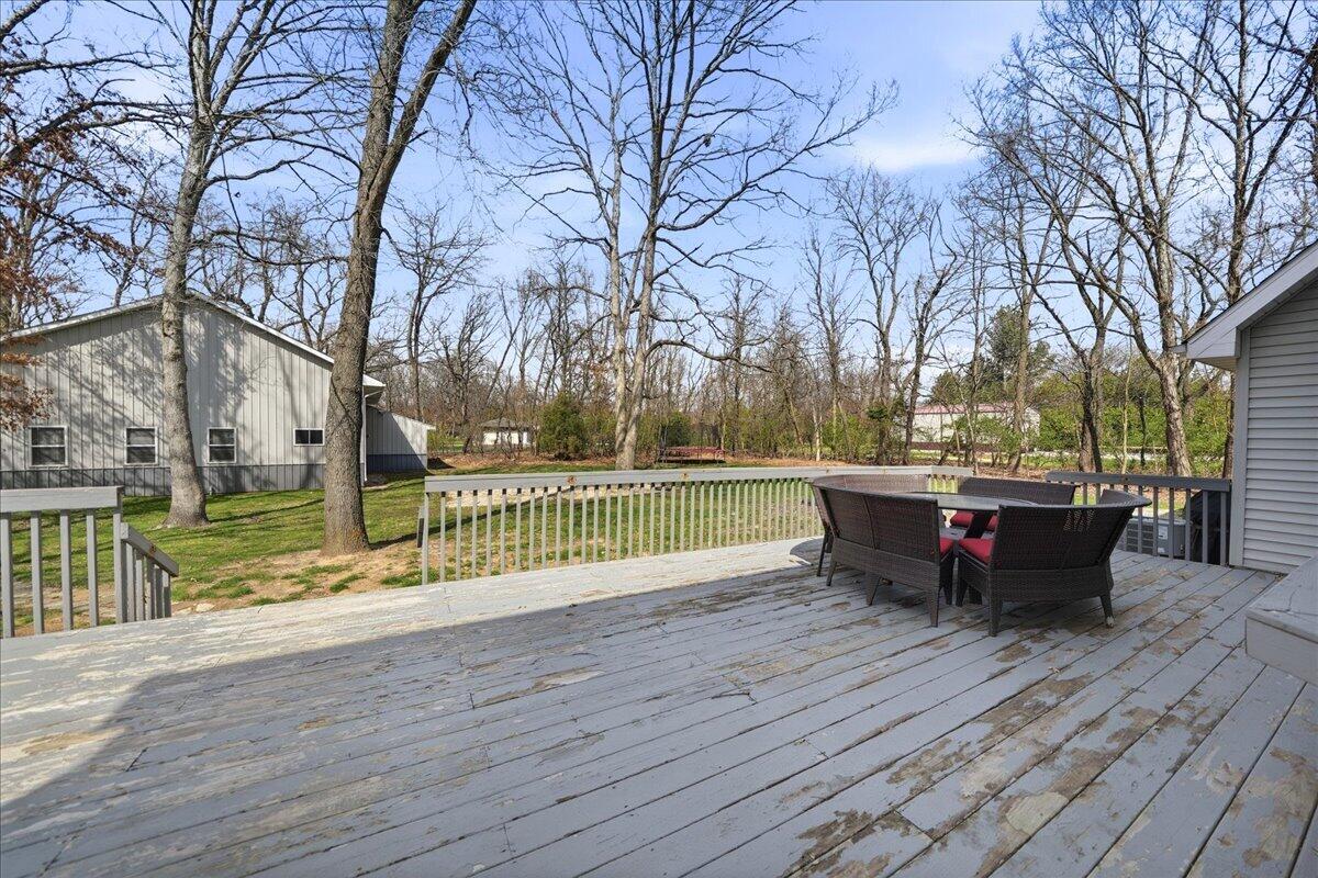 9642 West 1100th Street North Demotte, IN 46310 - Photo 28 of 37 a park view with a bench next to a yard