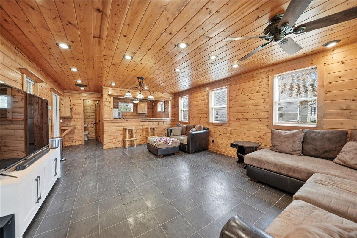 9642 West 1100th Street North Demotte, IN 46310 - Photo 31 of 37 a living room with furniture and a flat screen tv