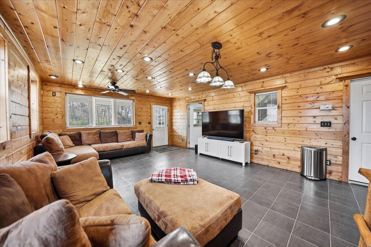 9642 West 1100th Street North Demotte, IN 46310 - Photo 32 of 37 a living room with furniture and a flat screen tv