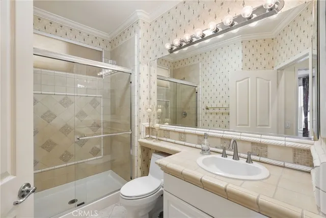 a spacious bathroom with a sink a large mirror and a bathtub