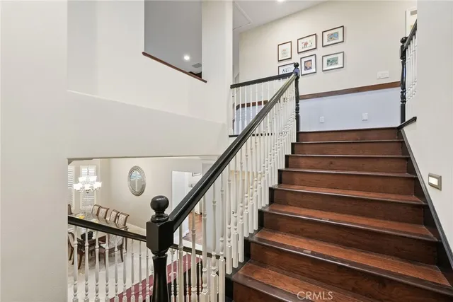 a front view of a house with swimming pool garden and patio