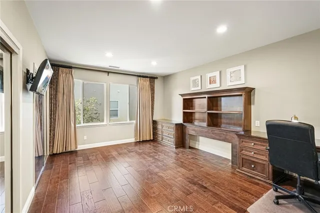 a view of a patio with table and chairs potted plants with wooden floor