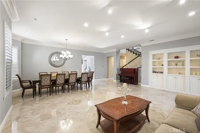 a living room with furniture and view of kitchen