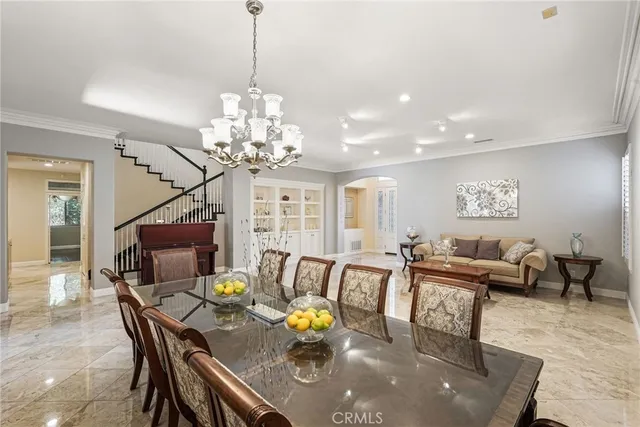 a large kitchen with stainless steel appliances granite countertop a stove a sink and a microwave