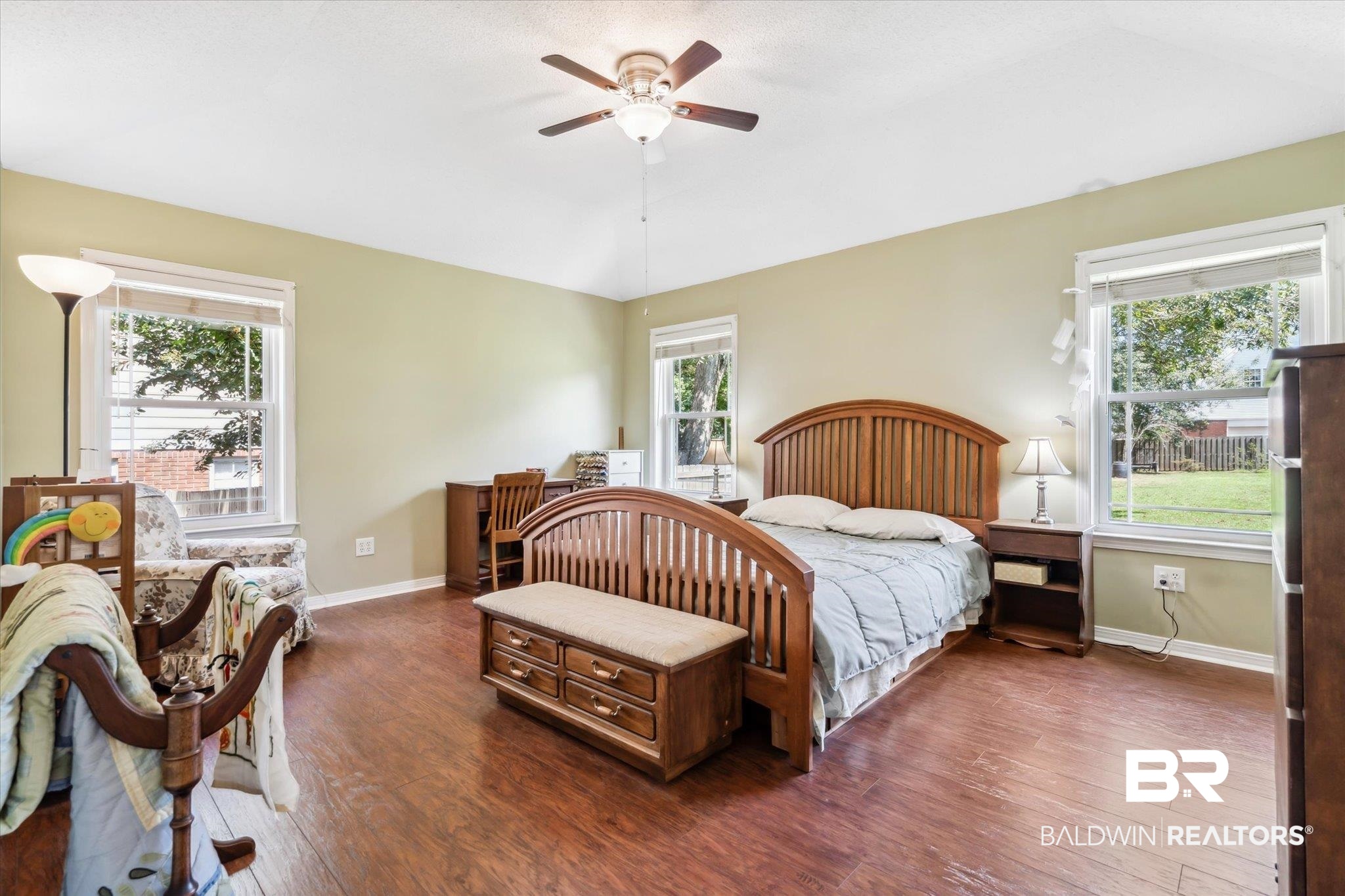8710 Three Notch Road Mobile, AL 36619 - Photo 13 of 30 Bedroom featuring dark hardwood / wood-style floors and multiple windows