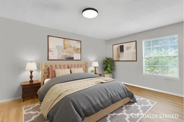 a bedroom with a large bed and a couch