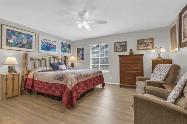 a bedroom with a bed and a couch