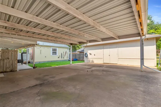 a utility room with dryer washer and fireplace