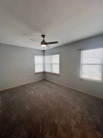 a view of empty room with windows
