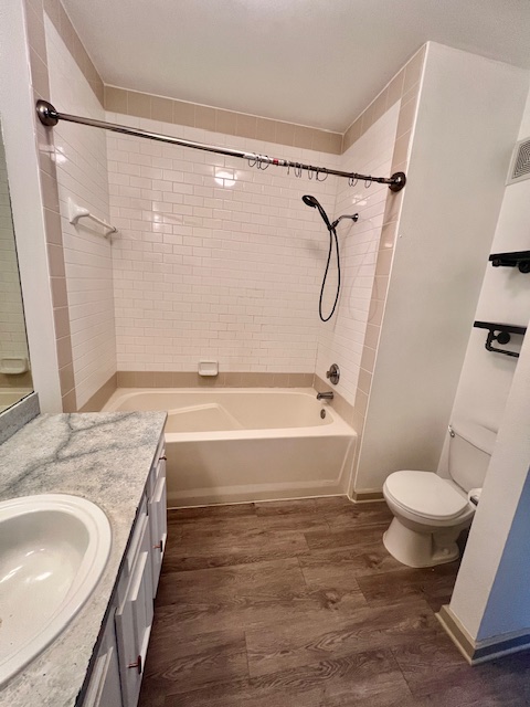1201 Grove Boulevard, Unit 1901 Austin, TX 78741 - Photo 16 of 19 a bathroom with a granite countertop sink toilet and shower