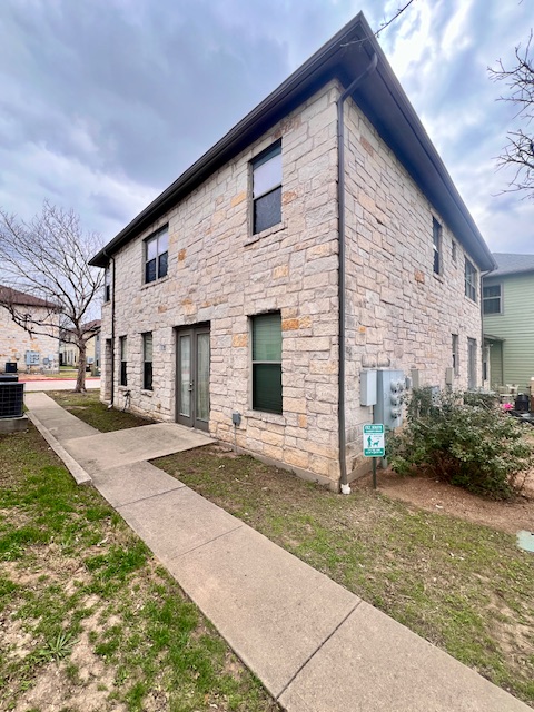 1201 Grove Boulevard, Unit 1901 Austin, TX 78741 - Photo 17 of 19 a front view of a house with garden