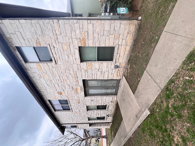 1201 Grove Boulevard, Unit 1901 Austin, TX 78741 - Photo 18 of 19 a front view of a house with a yard