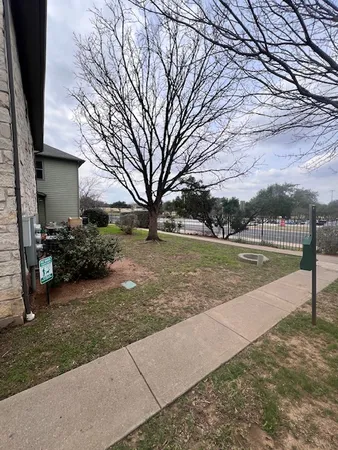 a view of backyard with swimming pool