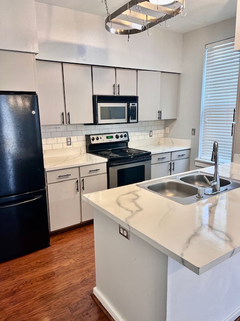 1201 Grove Boulevard, Unit 1901 Austin, TX 78741 - Photo 8 of 19 a kitchen with a sink a stove and refrigerator