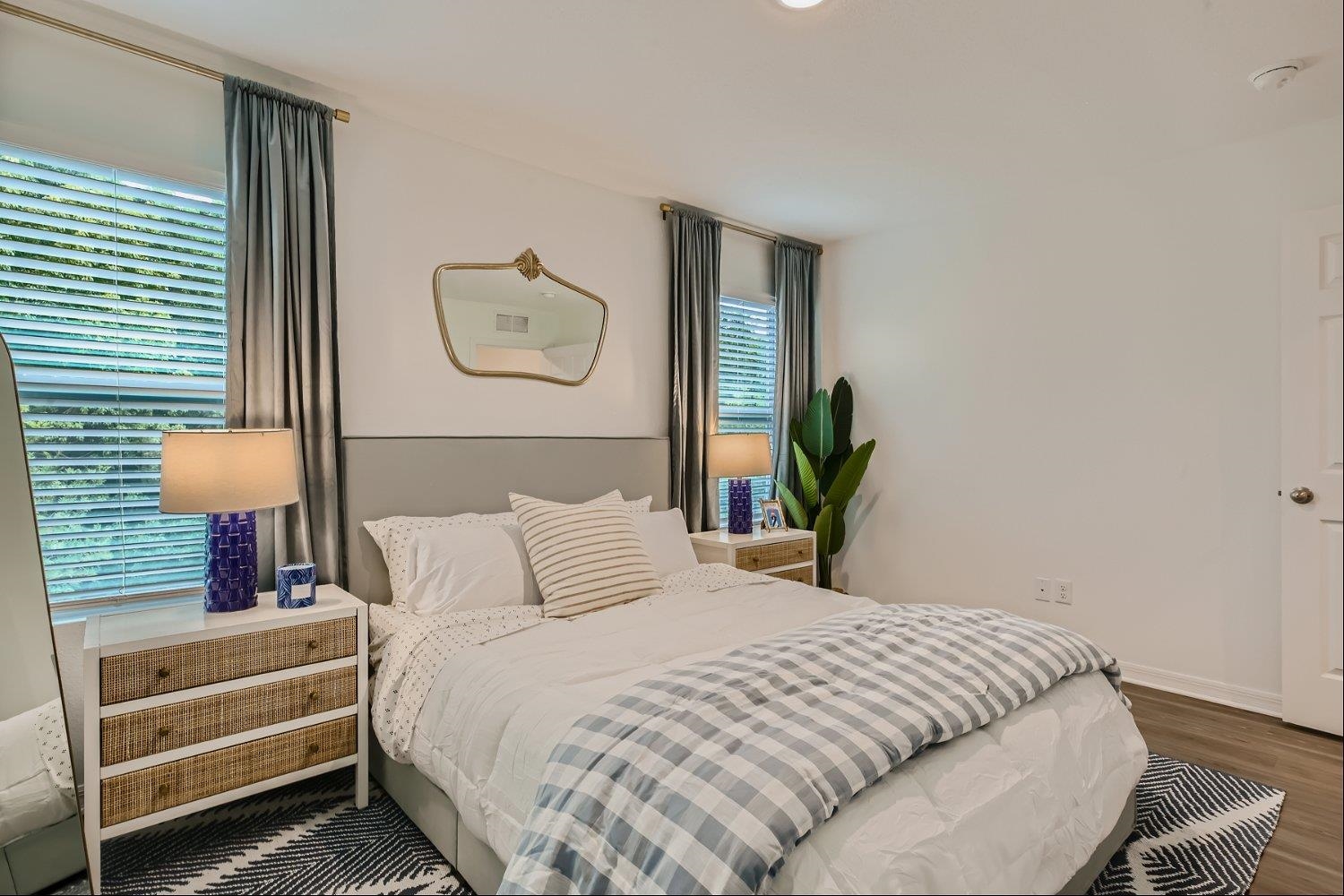 83 Pamplona Drive St. Augustine, FL 32086 - Photo 33 of 66 a bedroom with a bed and a lamp