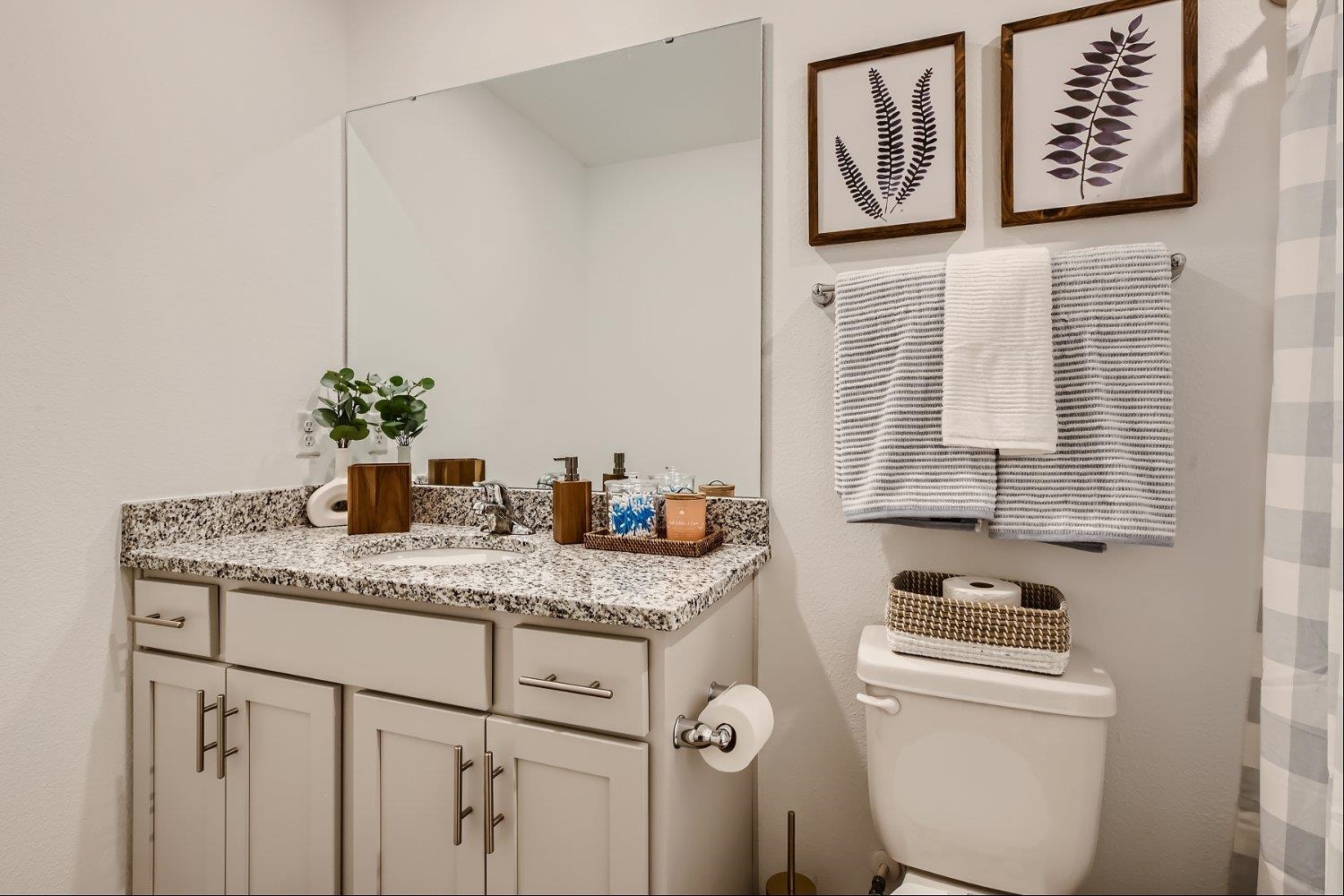 83 Pamplona Drive St. Augustine, FL 32086 - Photo 34 of 66 a bathroom with a granite countertop sink and a toilet