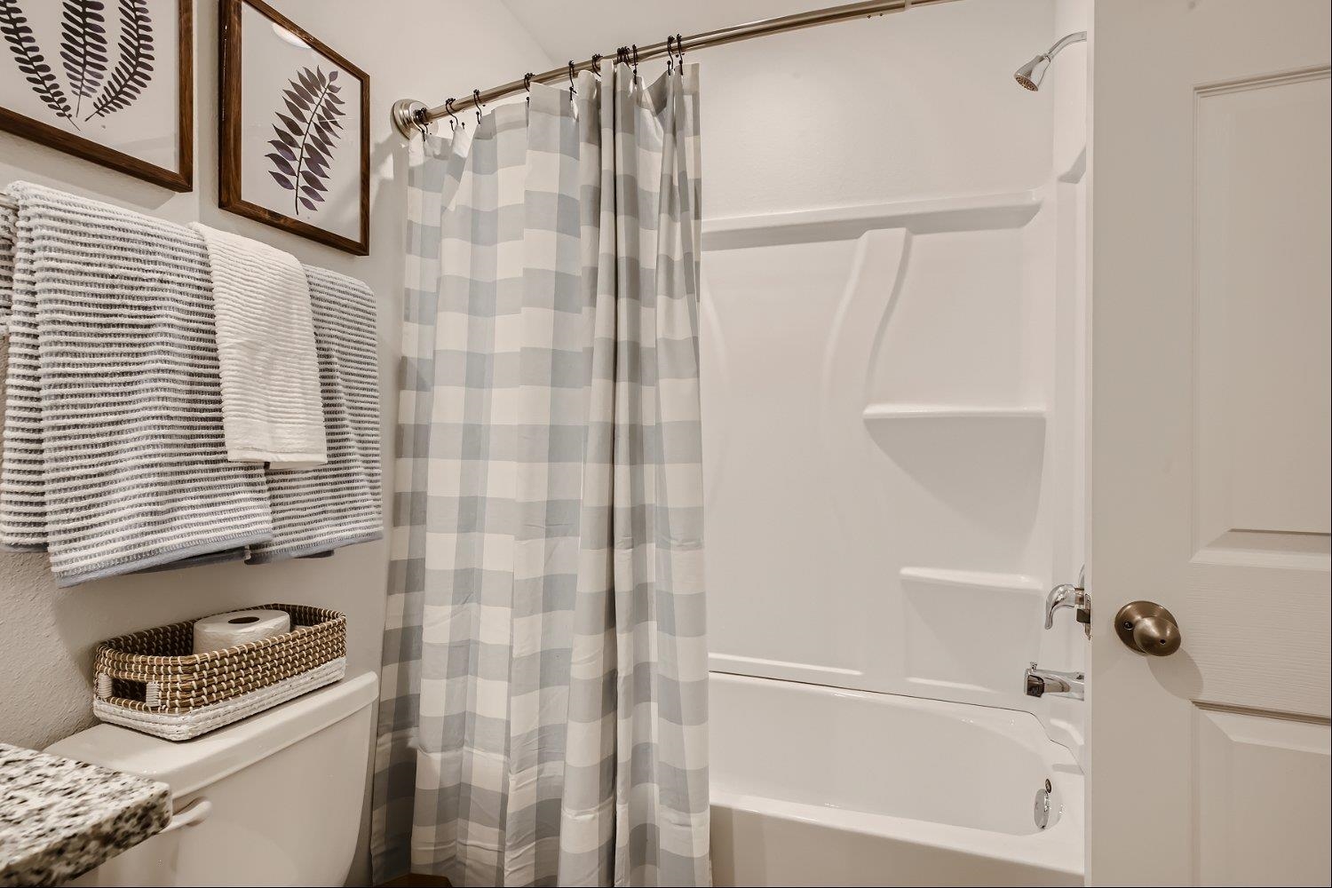 83 Pamplona Drive St. Augustine, FL 32086 - Photo 35 of 66 a bathroom with a shower curtain and a window