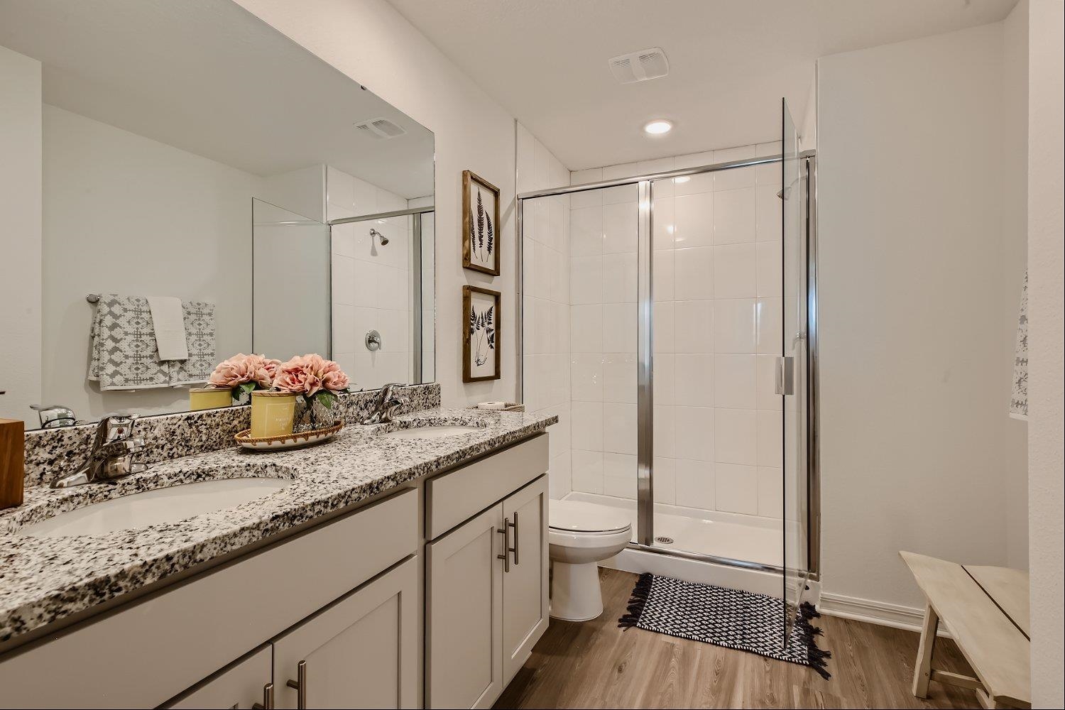 83 Pamplona Drive St. Augustine, FL 32086 - Photo 47 of 66 a bathroom with a granite countertop sink a mirror and shower