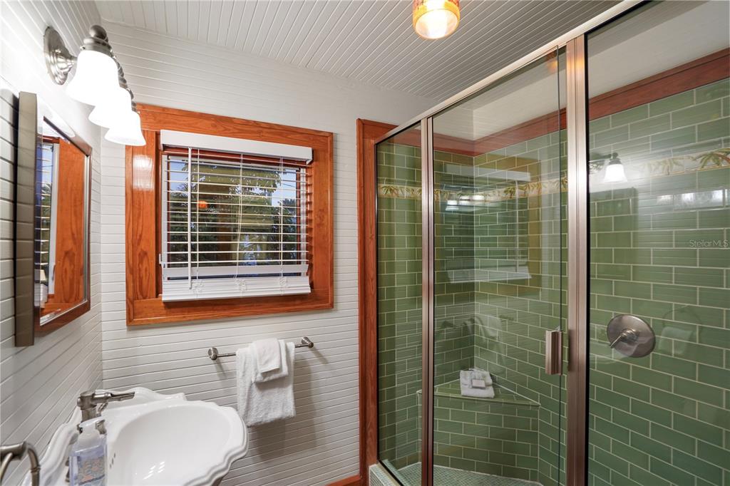 702 Pass A Grille Way St. Pete Beach, FL 33706 - Photo 33 of 41 a bathroom with a sink a toilet and shower