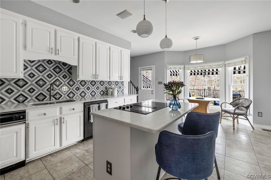 3200 Summerhurst Drive Midlothian, VA 23113 - Photo 11 of 50 a kitchen with stainless steel appliances granite countertop a sink a stove and a wooden cabinets