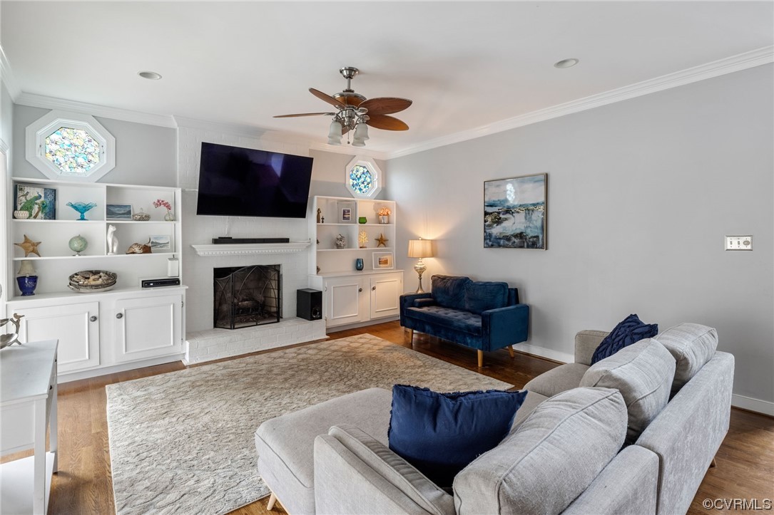 3200 Summerhurst Drive Midlothian, VA 23113 - Photo 17 of 50 a living room with furniture a flat screen tv and a fireplace