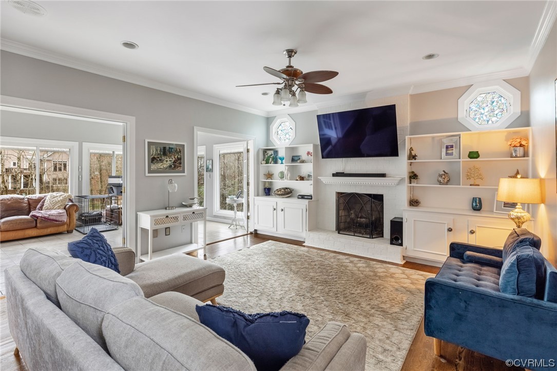 3200 Summerhurst Drive Midlothian, VA 23113 - Photo 19 of 50 a living room with furniture a flat screen tv and a fireplace
