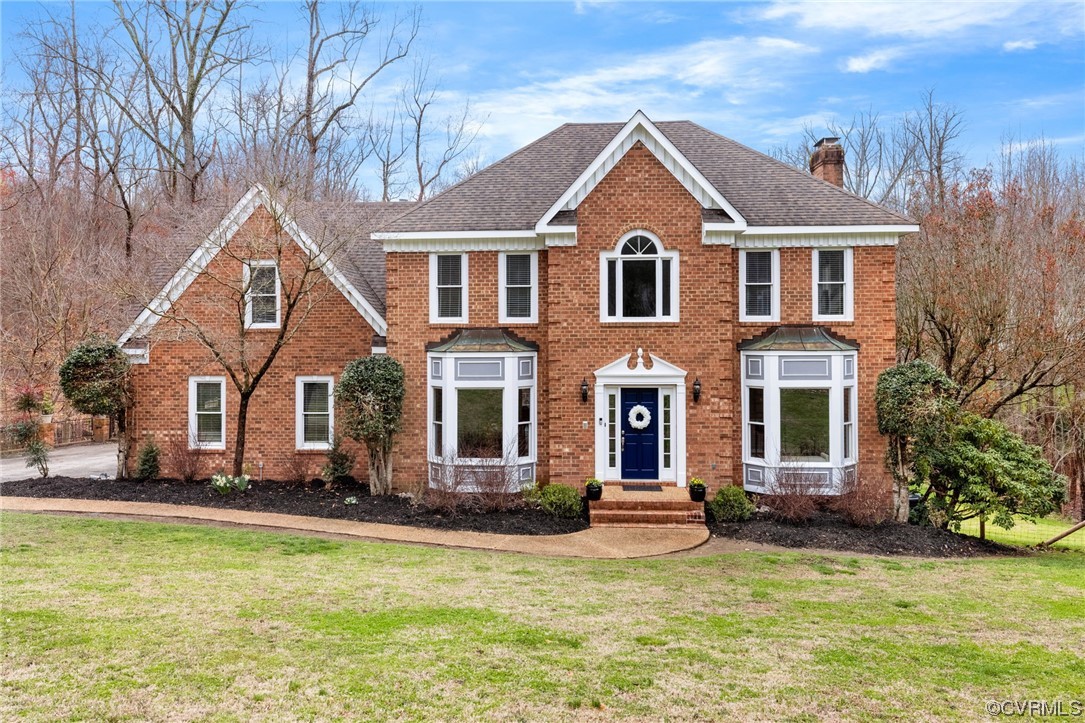 3200 Summerhurst Drive Midlothian, VA 23113 - Photo 2 of 50 a front view of a house with a yard table and chairs