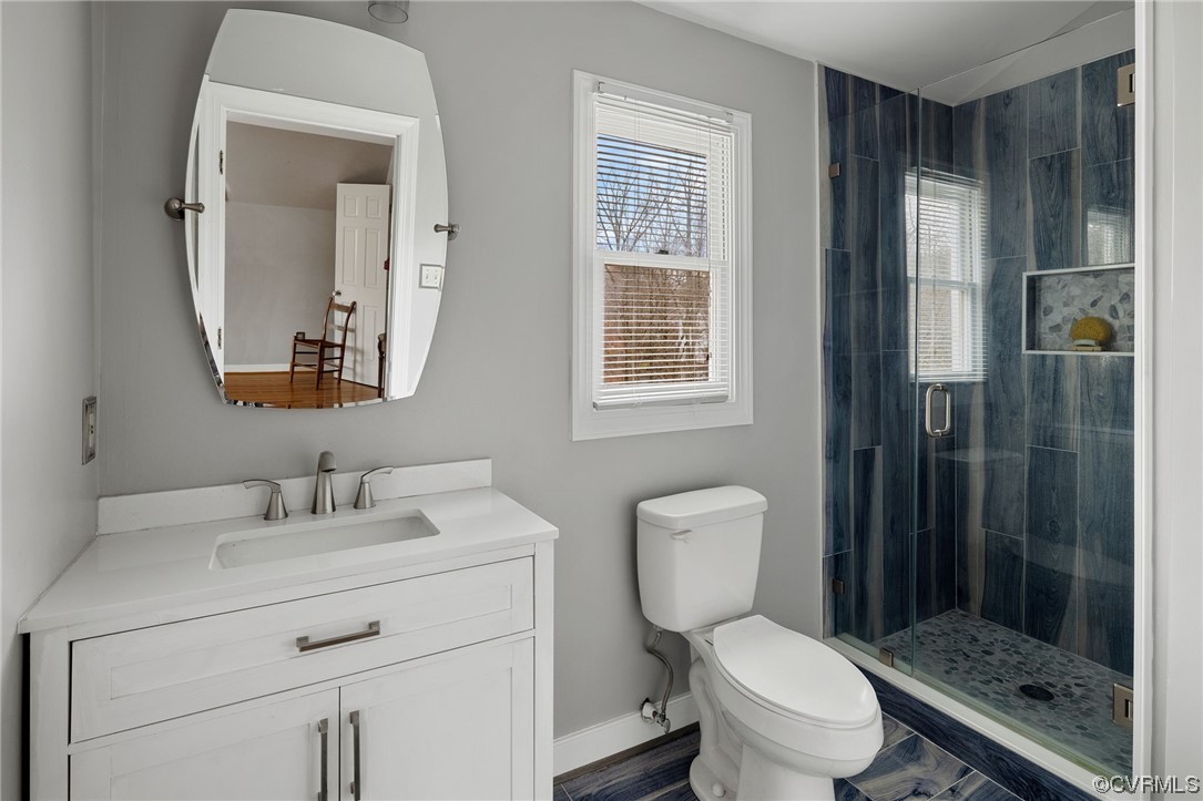 3200 Summerhurst Drive Midlothian, VA 23113 - Photo 31 of 50 a bathroom with a toilet sink vanity and shower