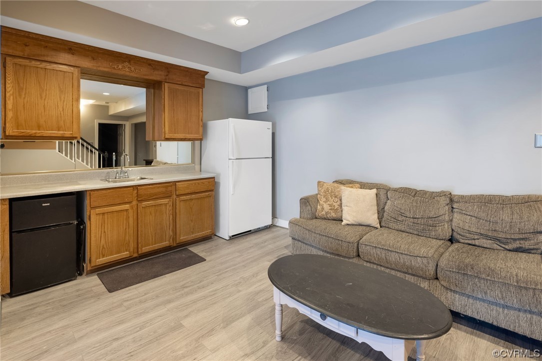 3200 Summerhurst Drive Midlothian, VA 23113 - Photo 35 of 50 a living room with furniture a sink and a refrigerator