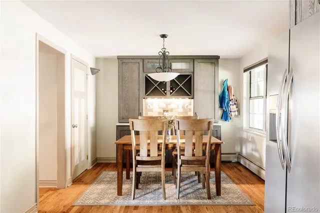 a view of a dining room with furniture and a window