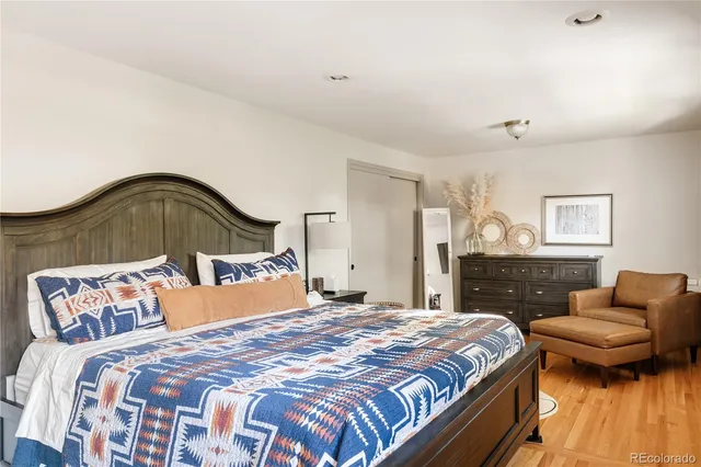 a bedroom with a bed and a couch