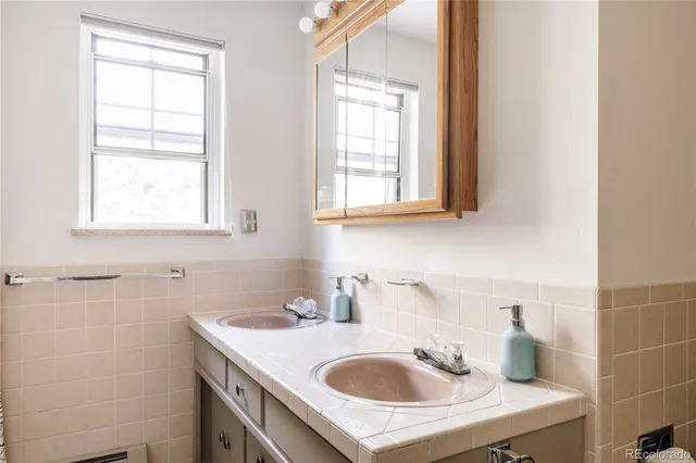 a bathroom with a sink and a window
