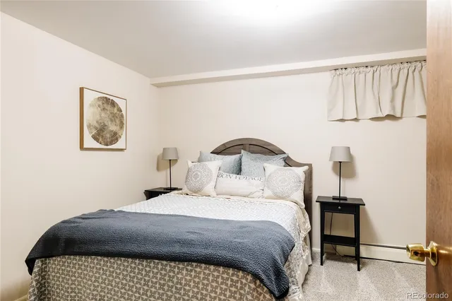 a bedroom with a bed and a view of bathroom