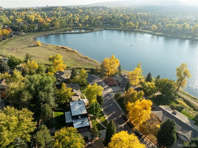 an aerial view of ocean with residential house with outdoor space