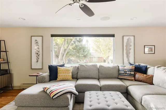 a living room with furniture and a large window