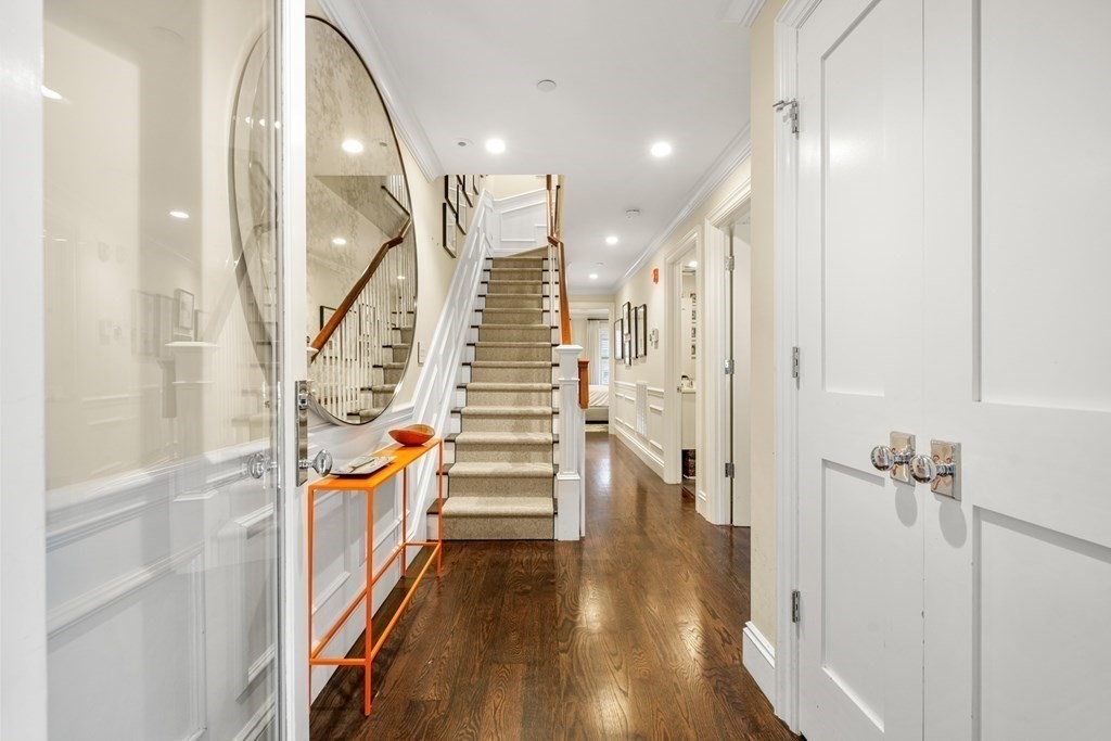 211 West Canton Street, Unit 1 Boston, MA 02116 - Photo 18 of 33 a view of a hallway with wooden floor and staircase