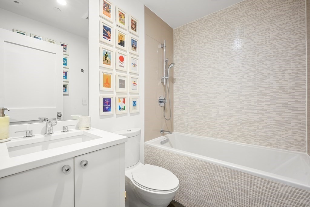 211 West Canton Street, Unit 1 Boston, MA 02116 - Photo 20 of 33 a bathroom with a sink a toilet and a bathtub