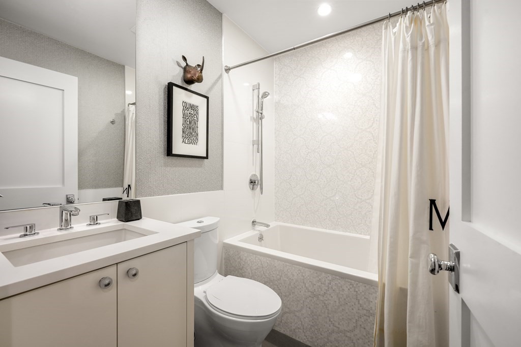 211 West Canton Street, Unit 1 Boston, MA 02116 - Photo 24 of 33 a bathroom with a granite countertop sink toilet and shower