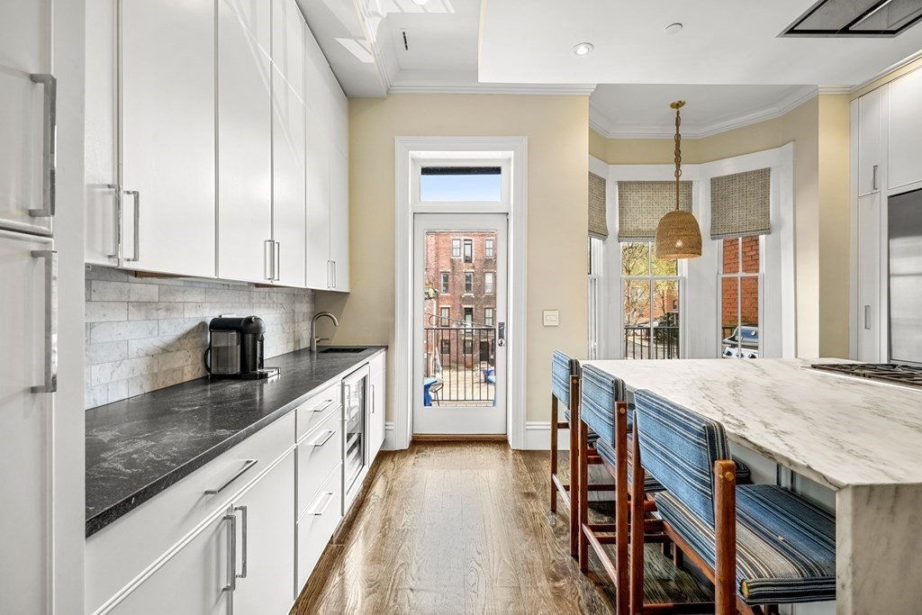 211 West Canton Street, Unit 1 Boston, MA 02116 - Photo 4 of 33 a kitchen with stainless steel appliances granite countertop a stove and a sink