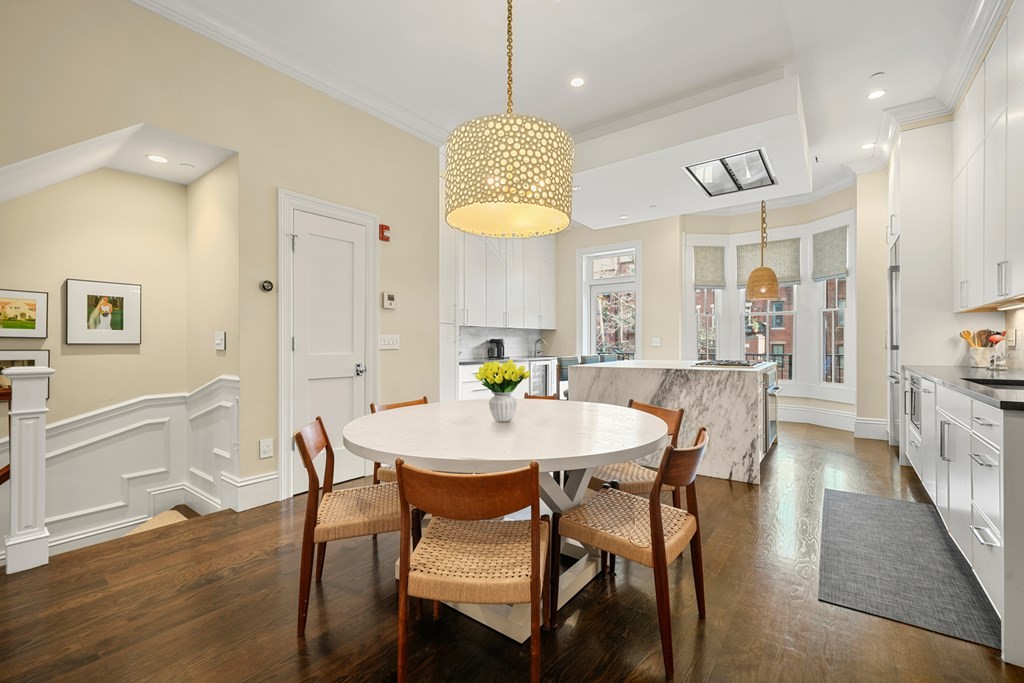 211 West Canton Street, Unit 1 Boston, MA 02116 - Photo 5 of 33 a view of a dining room with furniture and wooden floor