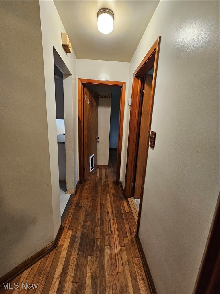 945 West Schaaf Road Cleveland, OH 44109 - Photo 13 of 27 Corridor with dark hardwood / wood-style flooring