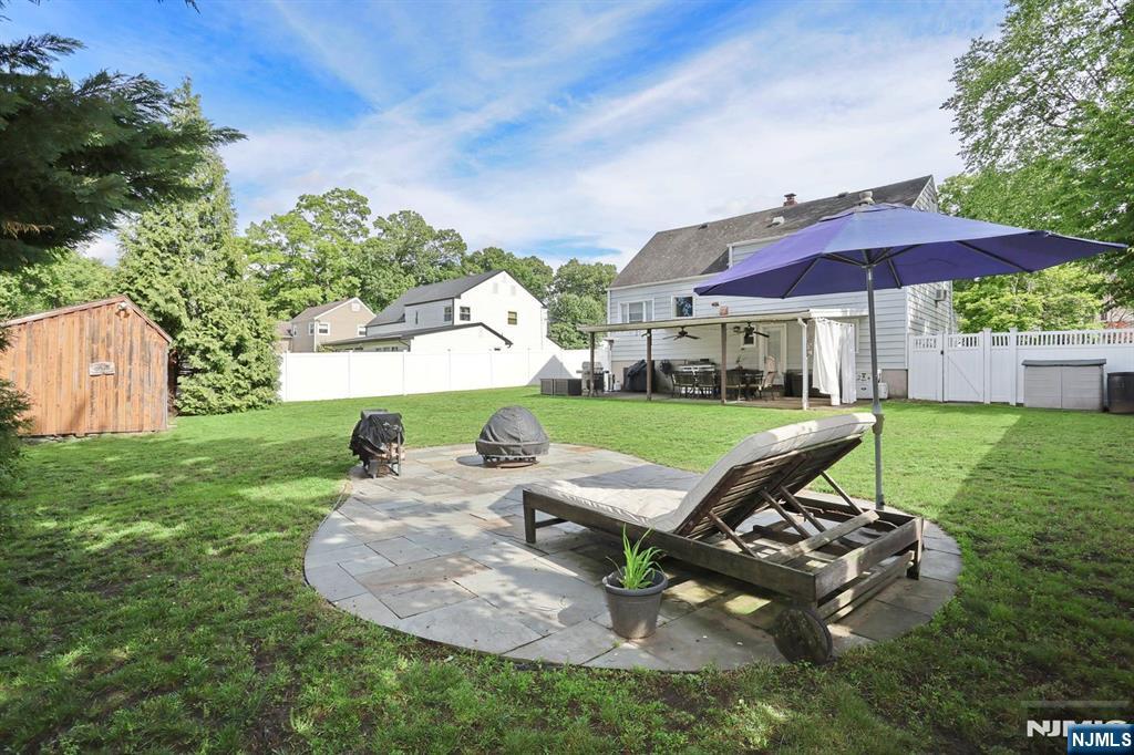 87 Barbara Road Dumont, NJ 07628 - Photo 43 of 48 an outdoor sitting area with chairs and fire pit