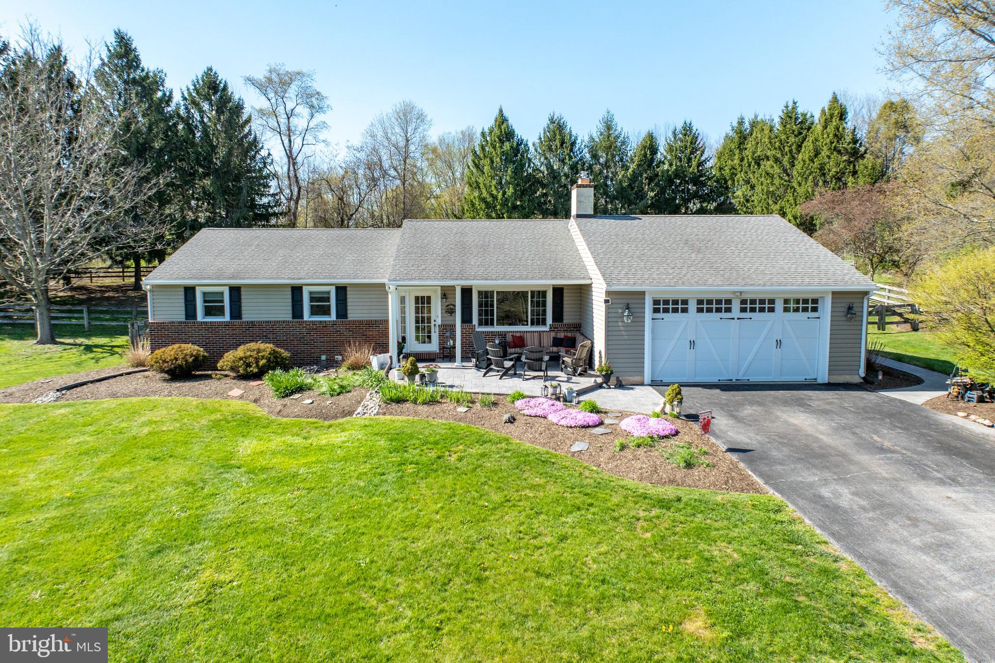 337 Saw Mill Road Pottstown, PA 19465 - Photo 1 of 57 a front view of a house with garden