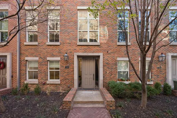 a front view of a house with yard