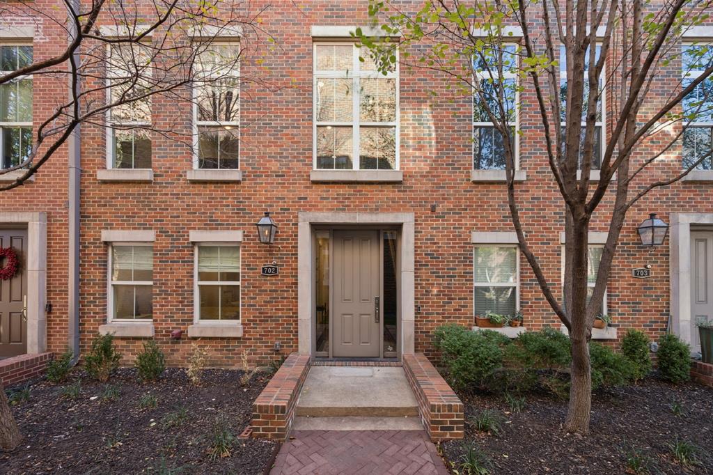 a front view of a house with yard